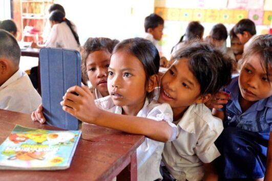School kids looking at tablet